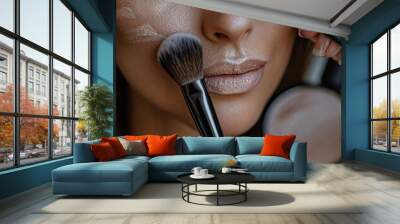 a woman is putting makeup on her face Wall mural