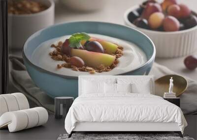 yogurt with fruit and granola in a blue bowl on a kitchen table Wall mural