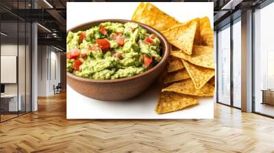 Creamy avocado guacamole dip served with crunchy tortilla chips on a clean white background, a delicious and simple snack ready to enjoy. Wall mural