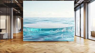 Glass podium floating on calm blue water with soft ripples and splashes, ideal for a product display Wall mural