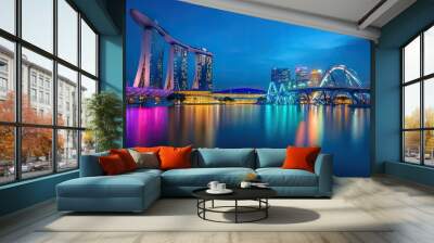 The famous Helix Bridge at night, reflecting neon lights over Marina Baycalm waters. Wall mural