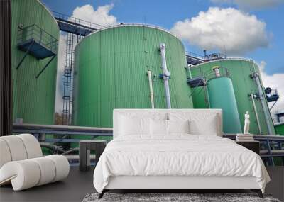 Biogas tanks on a biogas plant. Wastes recycling ecology concept. Green economics. Wall mural