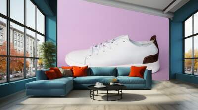 White leather sneakers on purple background. Copy space. Wall mural