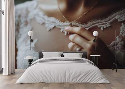 A close-up of the neckline of a wedding dress, with a girl's hand on it and a wedding ring on her ring finger Wall mural