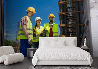 Architect supervising work on the construction site of a building Wall mural