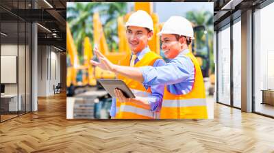 asian engineer discussing plans on construction site Wall mural