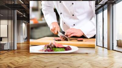 Chef in restaurant kitchen preparing food Wall mural