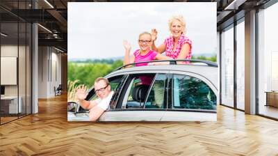 Family driving in car Wall mural