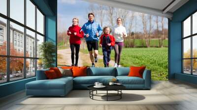 Family is running outdoors Wall mural