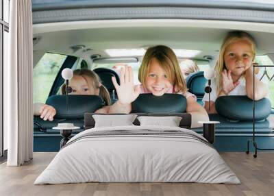 Family travelling by car Wall mural