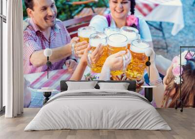 People enjoying food and drink in Bavarian beer garden Wall mural