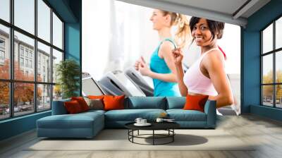 People in sport gym on treadmill running Wall mural