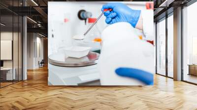 Pharmacist pouring white powdered chemical Wall mural