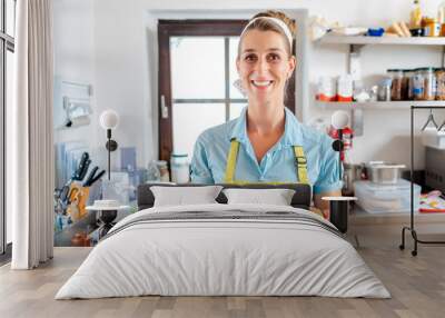 Portrait of a smiling woman showing sweet dessert Wall mural