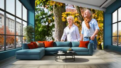 Senior man and woman, husband and wife, embracing each other in love Wall mural