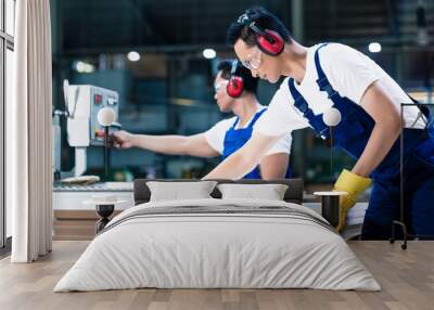 two wood workers in carpentry cutting boards Wall mural