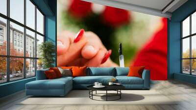 Woman in nail salon receiving manicure Wall mural