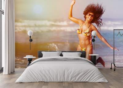 Woman on beach in summer vacation Wall mural