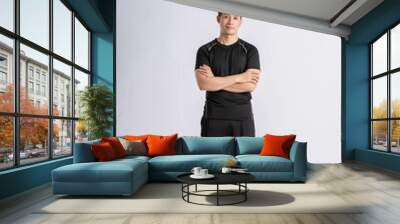 Full body Asian man wearing sportswear posing on white background Wall mural