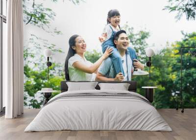 image of asian family walking in the park Wall mural