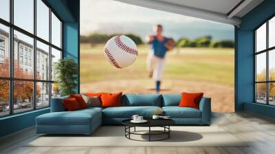 Baseball, sport and ball with a sports athlete or pitcher throwing and pitching a ball during a game or match on a court. Fitness, workout and exercise with an athletic person training outside Wall mural