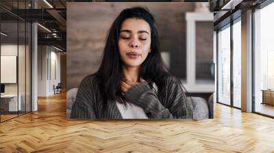 Depression, sad and woman with eyes closed in home thinking of problems. Anxiety, mental health and unhappy, depressed and lonely female on sofa in living room trying to calm down and relax in house. Wall mural