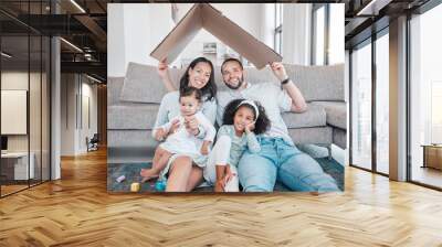 Family, cardboard roof with home insurance and together in house, love in portrait, unity with mortgage and happy family. Parents, children on living room floor, cover with protection and property. Wall mural