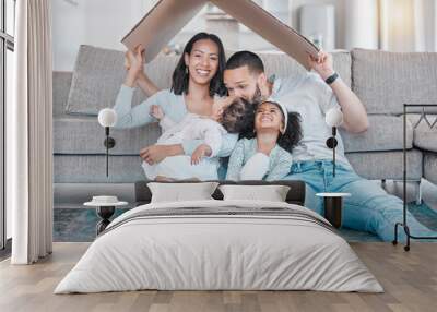 Happy family, cardboard roof or house life insurance in home living room floor in security, mortgage loan success or investment support. Property cover for smile, happy mother or father and children Wall mural