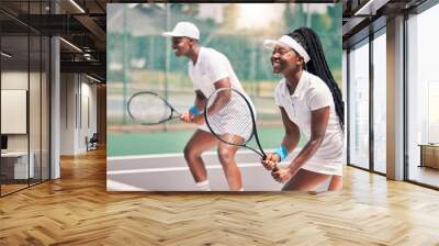 Tennis, sports and competition with a black woman and doubles partner playing a game on a court outdoor together. Fitness, team and exercise with a man and female tennis player at a venue for sport Wall mural