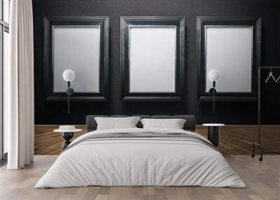 Three blank vertical frames on a dark wall with wooden flooring in a modern gallery room. Wall mural