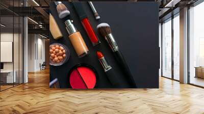 Creative concept beauty fashion photo of cosmetic products make up brushes kit lipstick foundation cream eyeshadows on black background. Wall mural