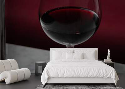 Wine glass at night on a marble table Wall mural