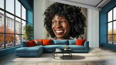 Portrait of a smiling black businesswoman looking aside. Headshot image Wall mural