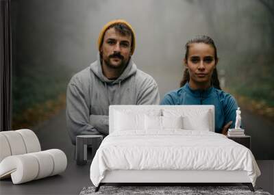 Portrait of two determined runners during a morning jog. Wall mural