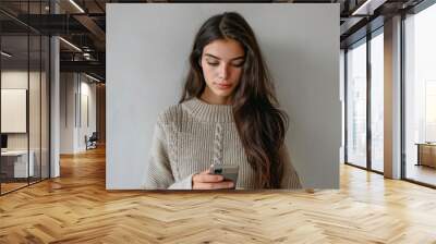 Casual Young Woman Texting  Wall mural