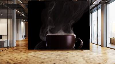 Cup of coffee with steam isolated on black Wall mural