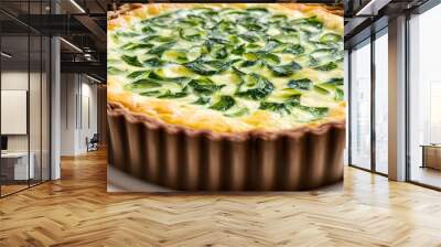 A beautifully baked spinach quiche with a golden-brown crust, featuring a rich and creamy filling studded with fresh spinach leaves Wall mural