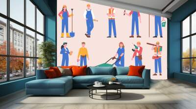 Cartoon builders, construction workers in uniform. Builder female and male characters holding shovel, roller and wheelbarrow. Splendid vector set Wall mural