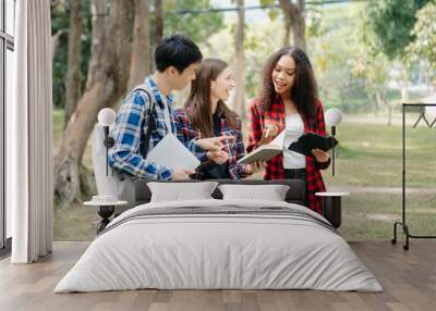 Cheerful group of diverse college students in casual attire walking together, enjoying campus life, and engaging in conversation. 
 Wall mural