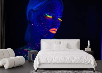 Portrait of Beautiful Fashion Woman in Neon UF Light. Model Girl with Fluorescent Creative Psychedelic MakeUp, Art Design of Female Disco Dancer Model in UV, Colorful Abstract Make-Up Wall mural