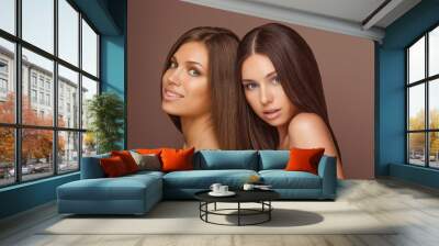 Portrait of two Beautiful Women with Long Hair and Clean Skin Wall mural