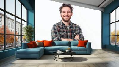 Happy young man in casual attire with folded arms, against a white background , background blur Wall mural