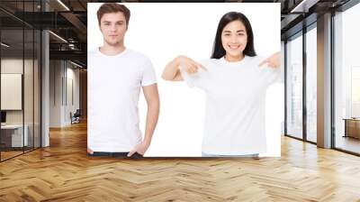 Asian girl and man in blank template t shirt isolated on white background. Guy and young woman in tshirt with copy space and mock up for advertising. White shirts. Front view Wall mural