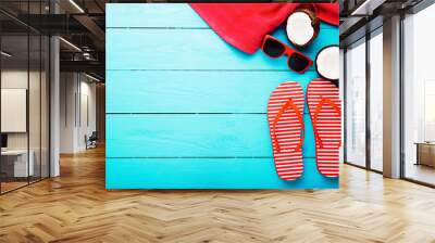 Fruits, flip flops, sunglasses and towel on blue wooden floor. Top view and copy space Wall mural