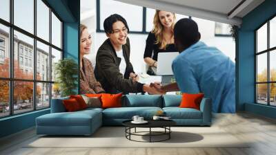 Teamwork, handshake and business people in meeting for collaboration, planning and thank you. Marketing agency, diversity and men and women shaking hands for success, agreement and deal in office Wall mural