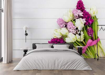 Bouquet of white tulips and pink hyacinth flowers. Copy space, top view. Wall mural