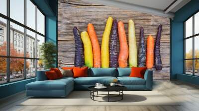 Organic food. Colorful carrots on wooden background. Top view, copy space.  Wall mural