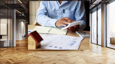 A businessman, a real estate sales representative, is analyzing the company's profits with his planned success graph. Wall mural