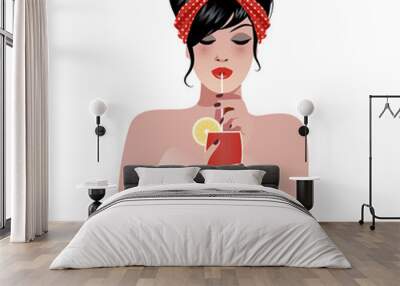 Beautiful pin up girl wearing a 50's style headscarf, drinking a cocktail or juice through a straw Wall mural