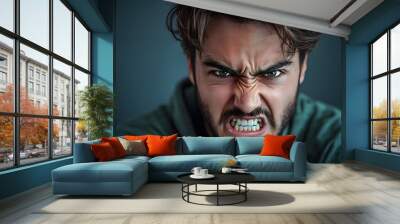 Angry young man with intense expression, close-up portrait, emotional and fierce look	 Wall mural